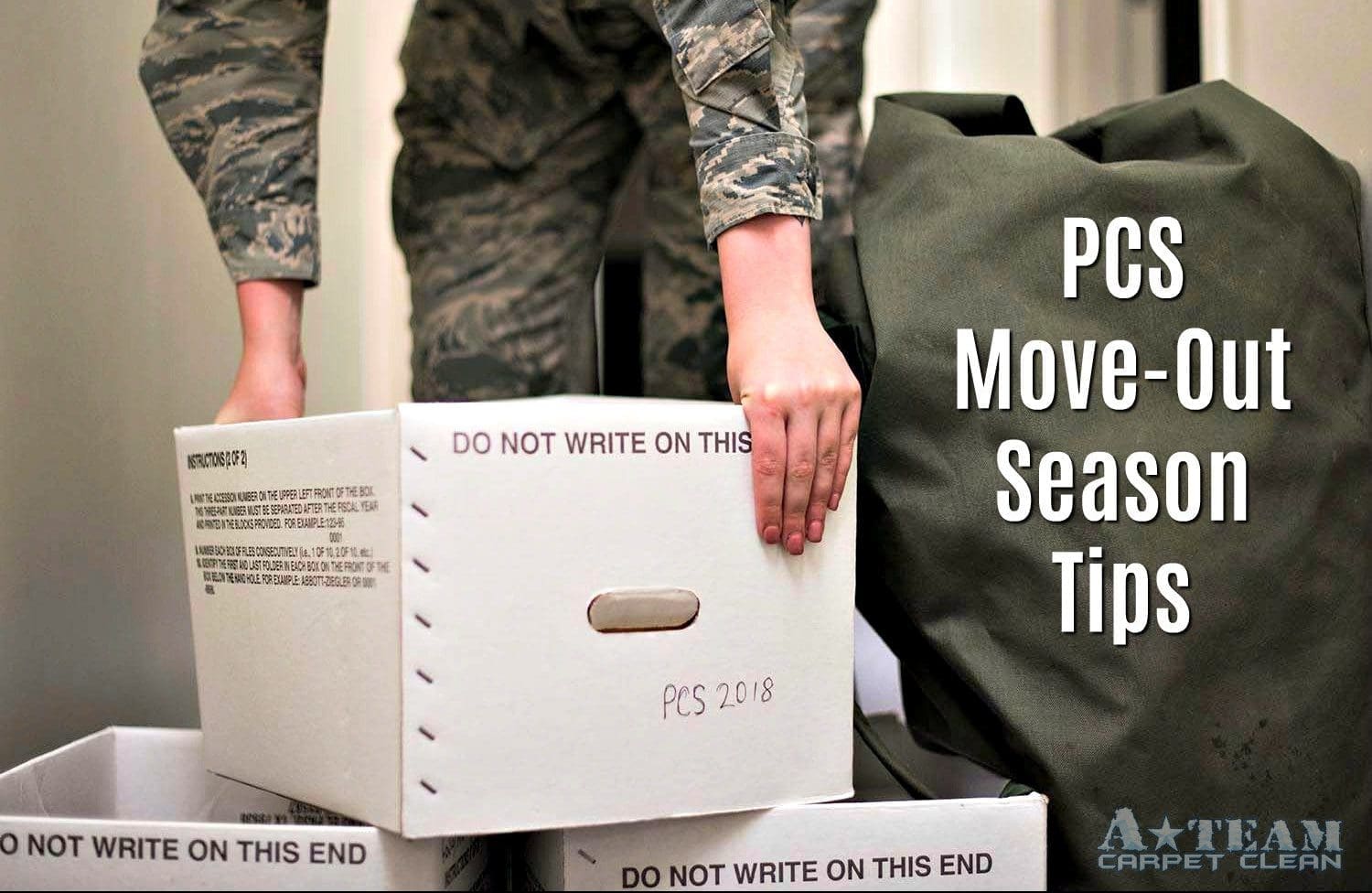 A person in uniform moving boxes into their new home.
