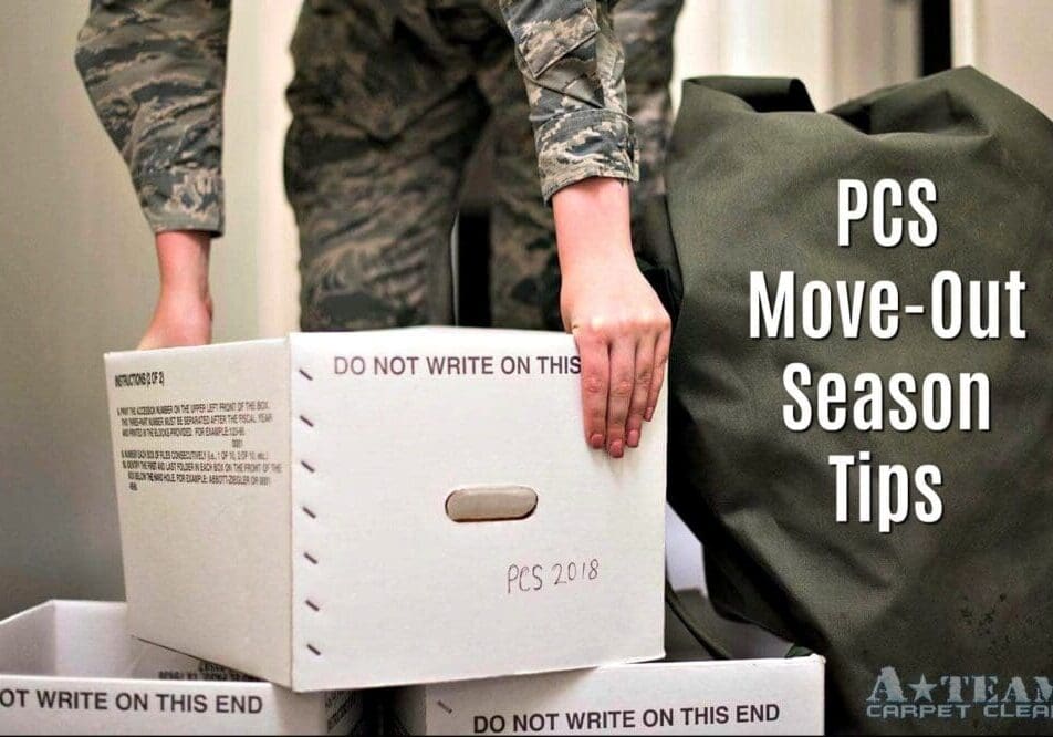 Military personnel packing boxes for relocation.